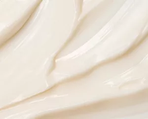 Close-up ivory cream texture.