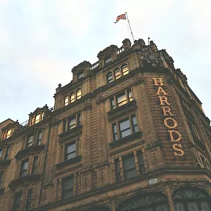 A brown building with a glad on the roof